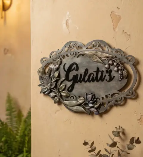 Handcrafted Oval Name Plate with Ornamental Frame, Raised Script Lettering & Floral Detailing