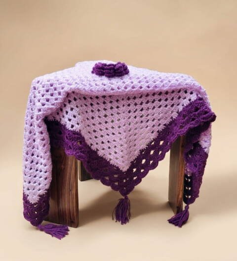 Handmade lavender and plum crochet shawl with tassel border and floral crochet detail by ShapersBliss